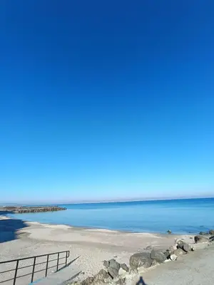 a beach with the ocean in the background at Pomorie Chaika Home in Pomorie
