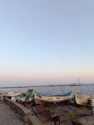 a group of boats on the shore of a body of water at Pomorie Chaika Home in Pomorie