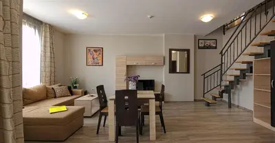 a living room with a couch and a table at Sorrento Sole Mare Apartments in Sveti Vlas