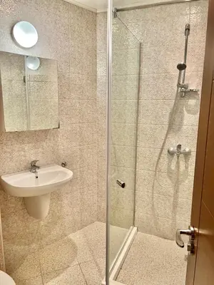 a bathroom with a shower and a sink at Varna Top Center 1 in Varna City