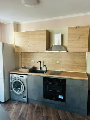 a kitchen with a sink and a washing machine at Varna Top Center 1 in Varna City