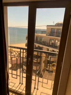 a view of the ocean from a balcony at Penthouse Happy Moments 4 in Sunny Beach