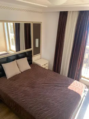 a bedroom with a bed and a large window at Penthouse Happy Moments 4 in Sunny Beach