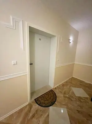 an empty room with a door and a rug at Good Mood Studio in Green Life First Line in Sozopol