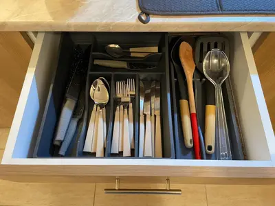 a drawer full of utensils in a cabinet at Good Mood Studio in Green Life First Line in Sozopol