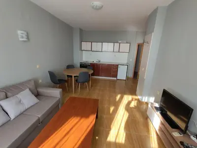 a living room with a couch and a table at Magic Dreams Apartments in Sveti Vlas