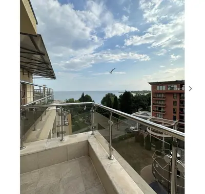 a view of the ocean from the balcony of a building at Seaside Apartment Nesebar in Nesebar
