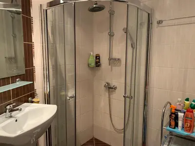 a bathroom with a shower and a sink at Apartment with terrace in Spa Complex in Burgas City
