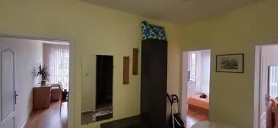a living room with yellow walls and a living room with at Reina Apart Flores Park in Sunny Beach