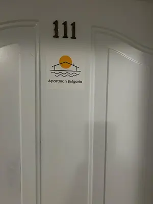 a sign on a wall above two doors at Peter Apartmanbulgaria-Imperial Fort Noks in Elenite