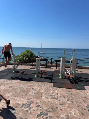 a man running on the beach near the ocean at Peter Apartmanbulgaria-Imperial Fort Noks in Elenite