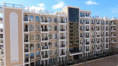 an apartment building with a lot of windows at Polarstar Apartment Verona in Sveti Vlas