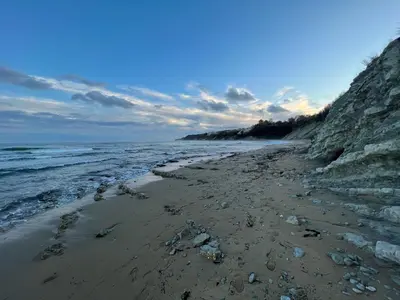 a sandy beach with rocks and the ocean at Black Sea Breeze Apartment No 3 in Byala