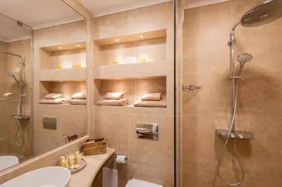 a bathroom with a shower and a toilet and a sink at Marina Varna Apartment-2BDR at South Bay Complex in Varna City