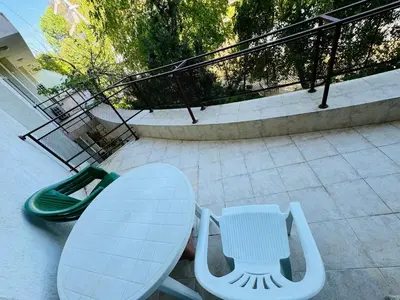 a table and two chairs sitting on a patio at SUN VILLAGE B 320 Apartment Sunny Beach in Sunny Beach