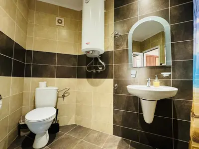 a bathroom with a toilet and a sink at ROYAL PALM 84 Studio Sveti Vlas in Sveti Vlas