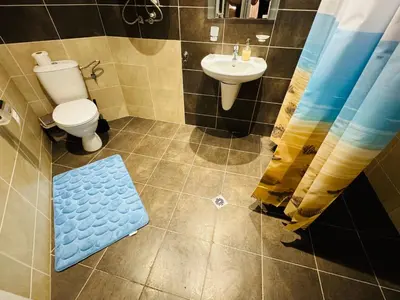 a bathroom with a toilet and a sink at ROYAL PALM 84 Studio Sveti Vlas in Sveti Vlas