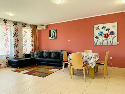 a living room with a couch and a table at VODENICATA 3 Apartament Sveti Vlas in Sveti Vlas