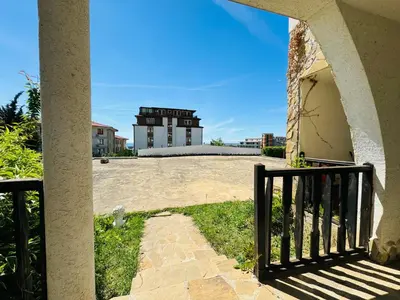 a view of a building from a porch at VODENICATA 3 Apartament Sveti Vlas in Sveti Vlas