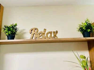 a wooden shelf with potted plants on it at Music in the sea in Varna City
