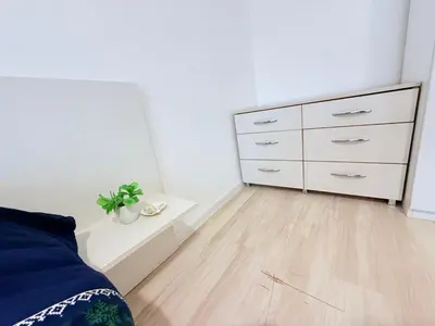 a bedroom with a bed and a dresser at 