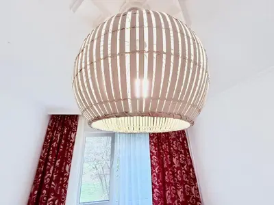 a large chandelier in a room with a window at 