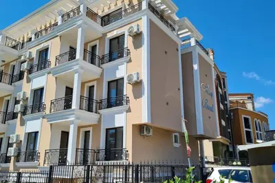 a large white building with balconies on it at DELUXE Beach Apartment in Sveti Vlas in Sveti Vlas