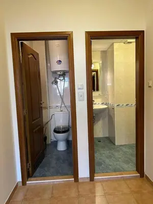a bathroom with a toilet and a sink at Tania's Home in Sunny Beach