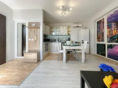 a kitchen with a table and a dining room at Artistic Apartment for 4 Guests in Burgas in Burgas City