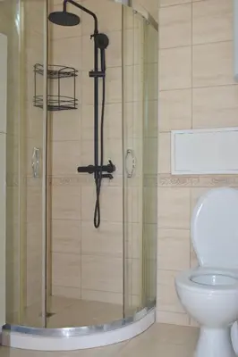 a shower in a bathroom with a toilet at Artistic Apartment for 4 Guests in Burgas in Burgas City