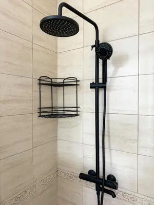 a shower with two lights in a bathroom at Artistic Apartment for 4 Guests in Burgas in Burgas City