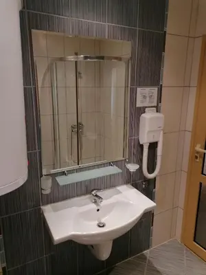a bathroom with a sink and a mirror at Avalon studio,Sunny Beach in Sunny Beach