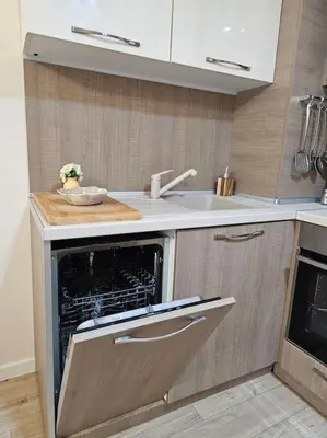 a kitchen with an oven and a sink in it at Serenity in the heart of Varna with free parking in Varna City