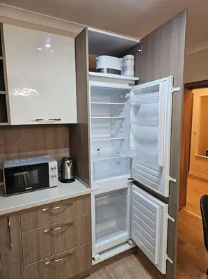 a kitchen with an open refrigerator and a microwave at Serenity in the heart of Varna with free parking in Varna City