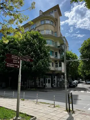 a street sign in front of a building at Glarus Apartment with Infinity Sea View in Varna City
