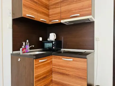 a kitchen with a sink and a microwave at ROMANCE MARIN 410 Studio Sunny Beach in Sunny Beach