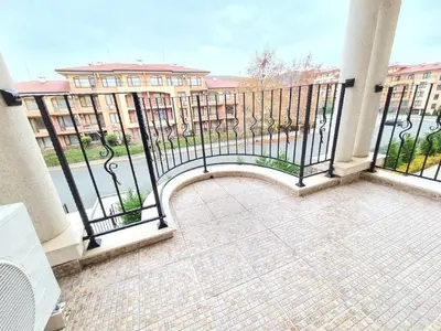 a balcony with a view of a building at Premier Lux apartmán in Sveti Vlas