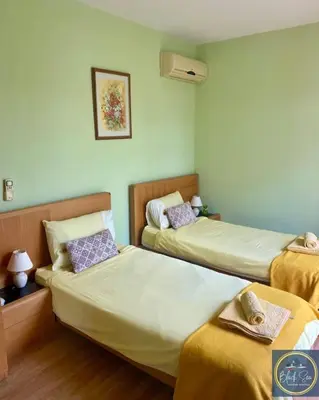 a hotel room with two beds at Scenic, 2 Bedroom Apt with Views in Kableshkovo