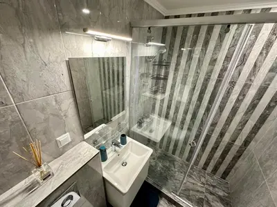 a bathroom with a sink and a glass shower at ONYX 1 - Menada Apartments in Sveti Vlas