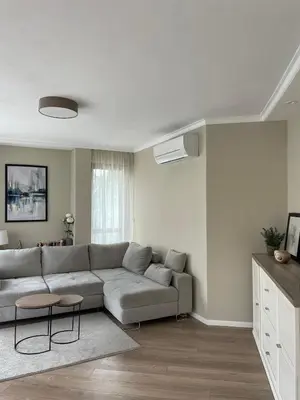 a living room with a couch and a table at Varna City Center Apartment in Varna City