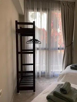 a bedroom with a ladder next to a window at Varna City Center Apartment in Varna City