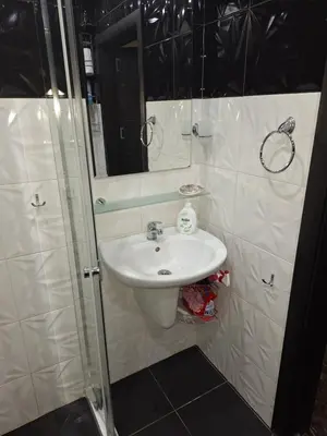 a bathroom with a sink and a mirror at Green Paradise apartman 105 in Primorsko