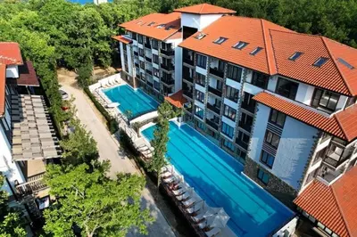 an aerial view of a building with a swimming pool at Green Paradise apartman 105 in Primorsko