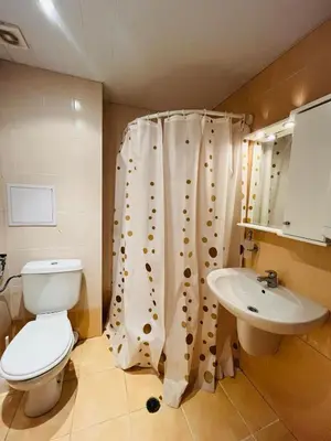 a bathroom with a toilet and a sink at Seafront apartment Lucky in Sveti Vlas