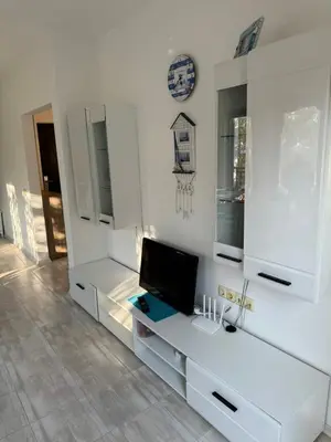 a white room with a desk with a computer on it at Marteo Apartments103 - Sozopol in Sozopol