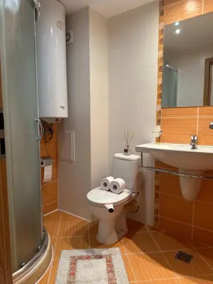 a bathroom with a toilet and a sink at River Park Studio in Sunny Beach