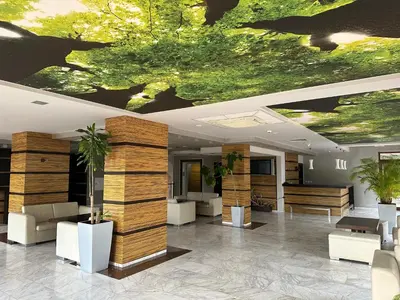 a lobby with a ceiling with bats on it at River Park Studio in Sunny Beach
