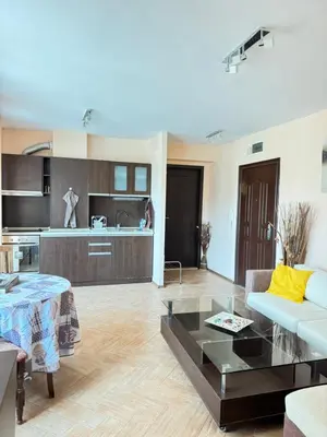 a living room with a couch and a table at Stan u moru in Pomorie