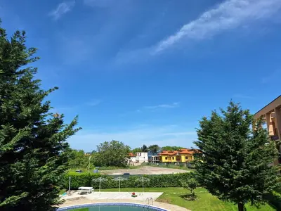 a view of a pool with trees and buildings at Созополи Хилс A11 in Sozopol
