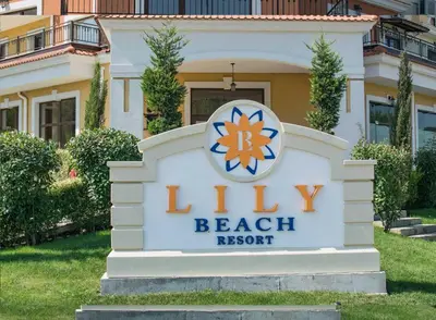 a sign for a beach resort in front of a house at Marteo Apartments 105 - Sozopol in Sozopol